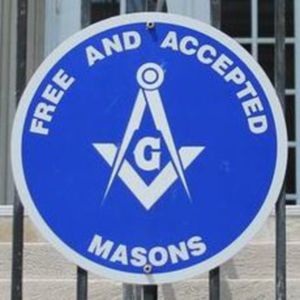 A sign that says "Free and Accepted Masons" with the mason symbol in the middle. 