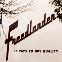 The wall of the Freelander's store that says "Freelander's: it pays to buy quality" 