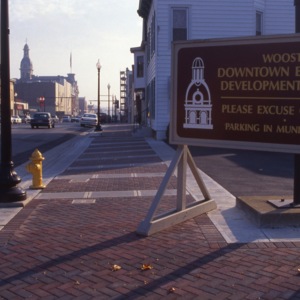 A sign on Wooster's main street for the Downtown Wooster economic development project. 