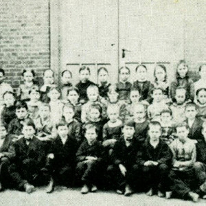 A large group photo of several children, circa 1912. 