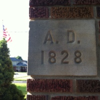 Plaque outside of Salem Lutheran Church that says "A.D. 1828". 